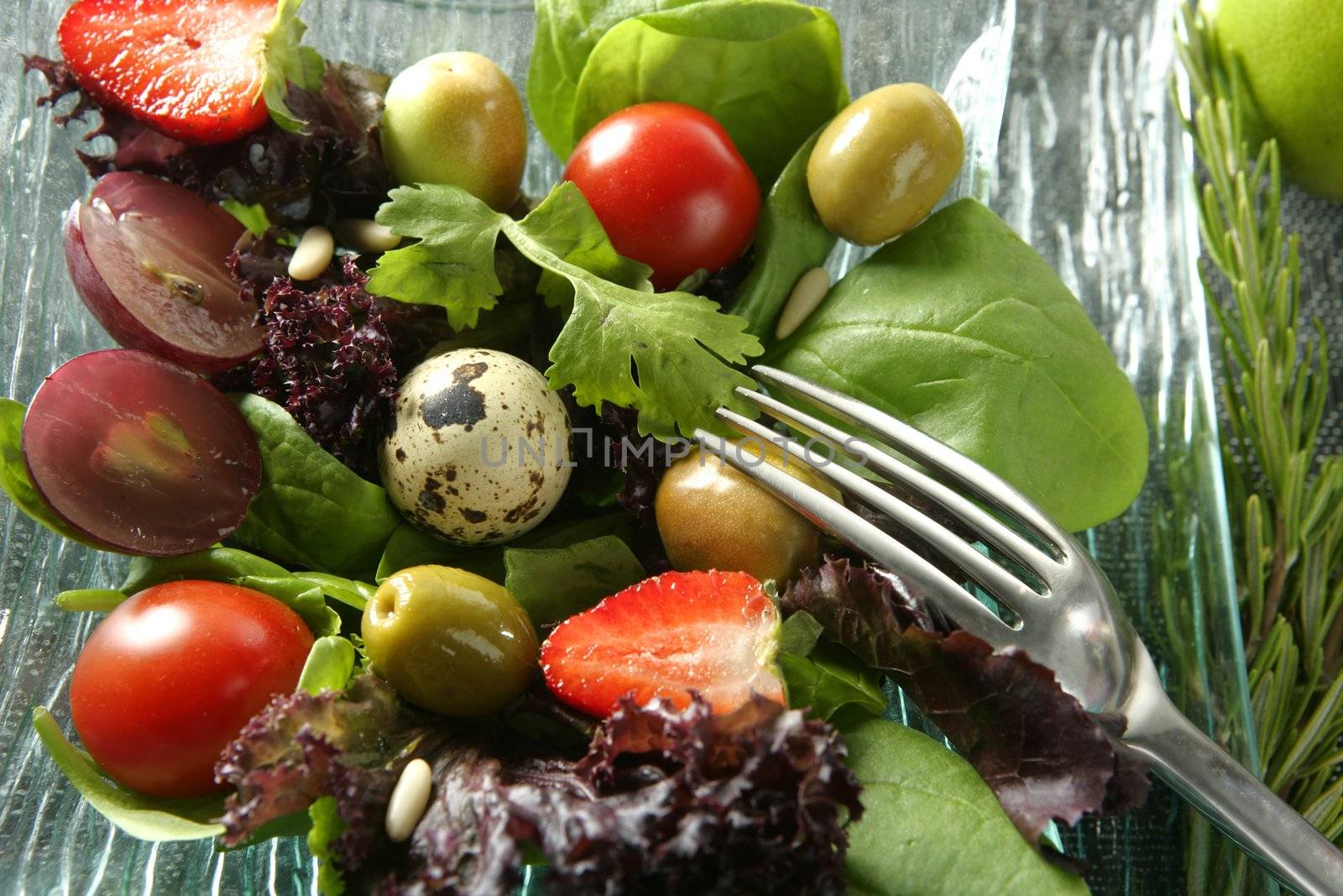 Varied salad with fruits and vegetables, original contemporary kitchen