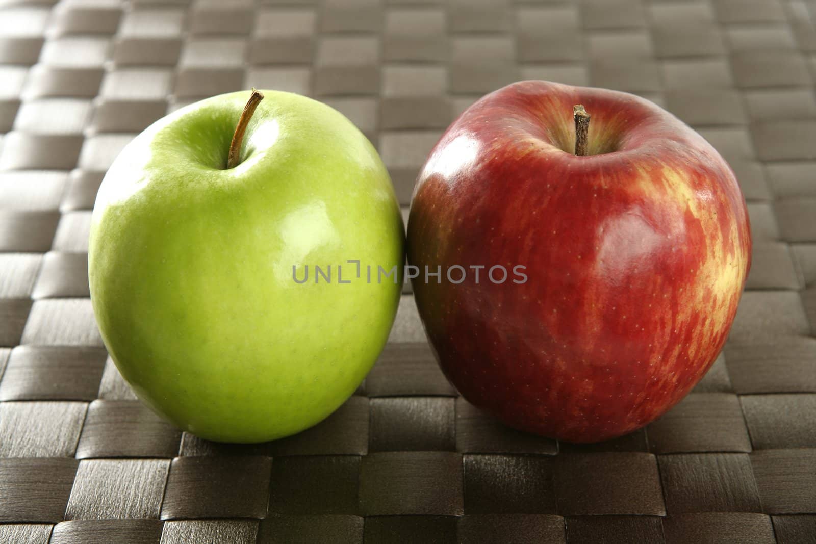 Sweet fruit, apples on a brown tablecloth