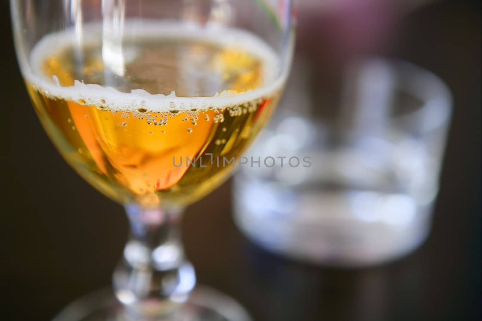 Beer cup macro closeup witu bubbles on selective focus