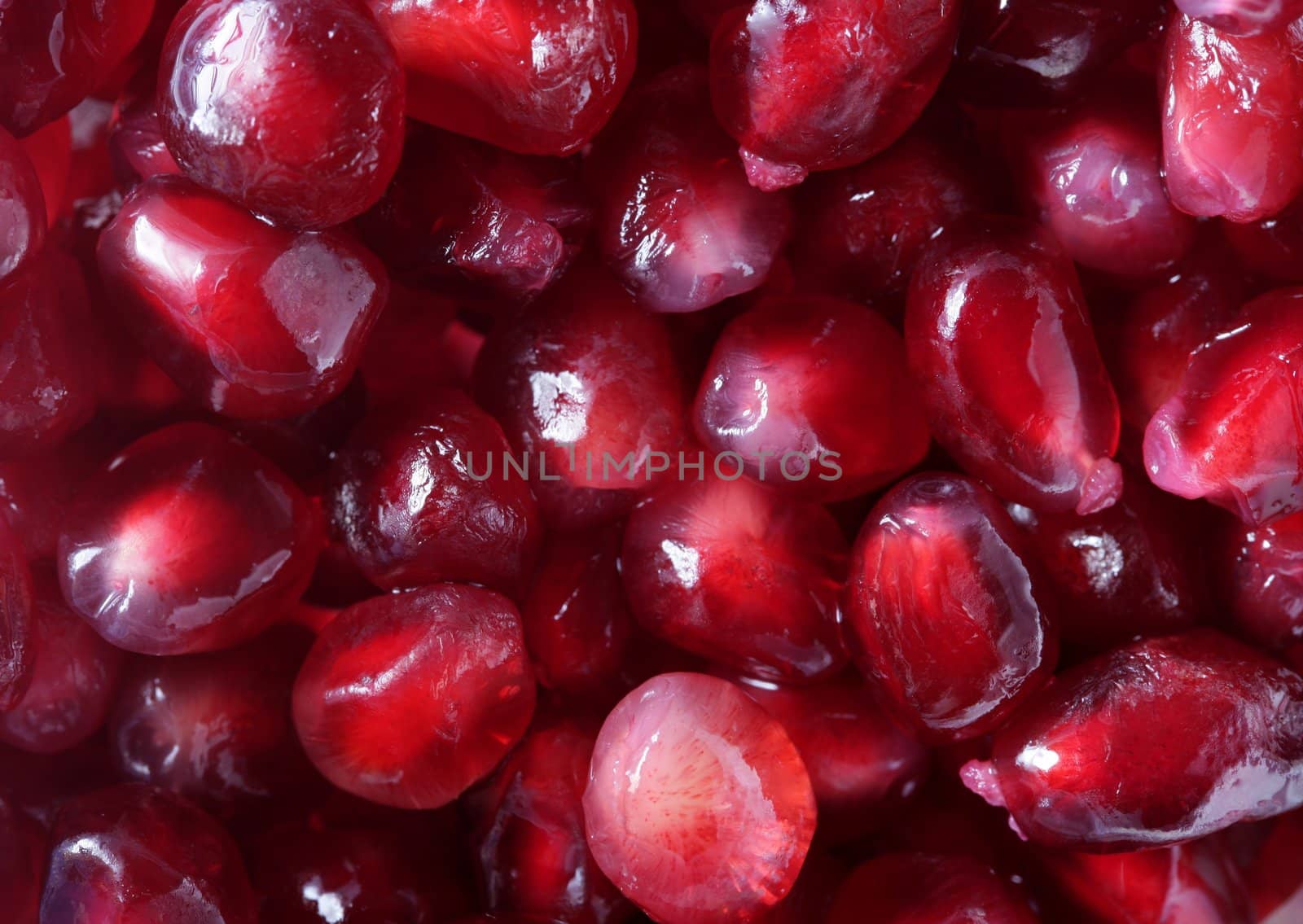 Grenade grain macro detail in vivid red color