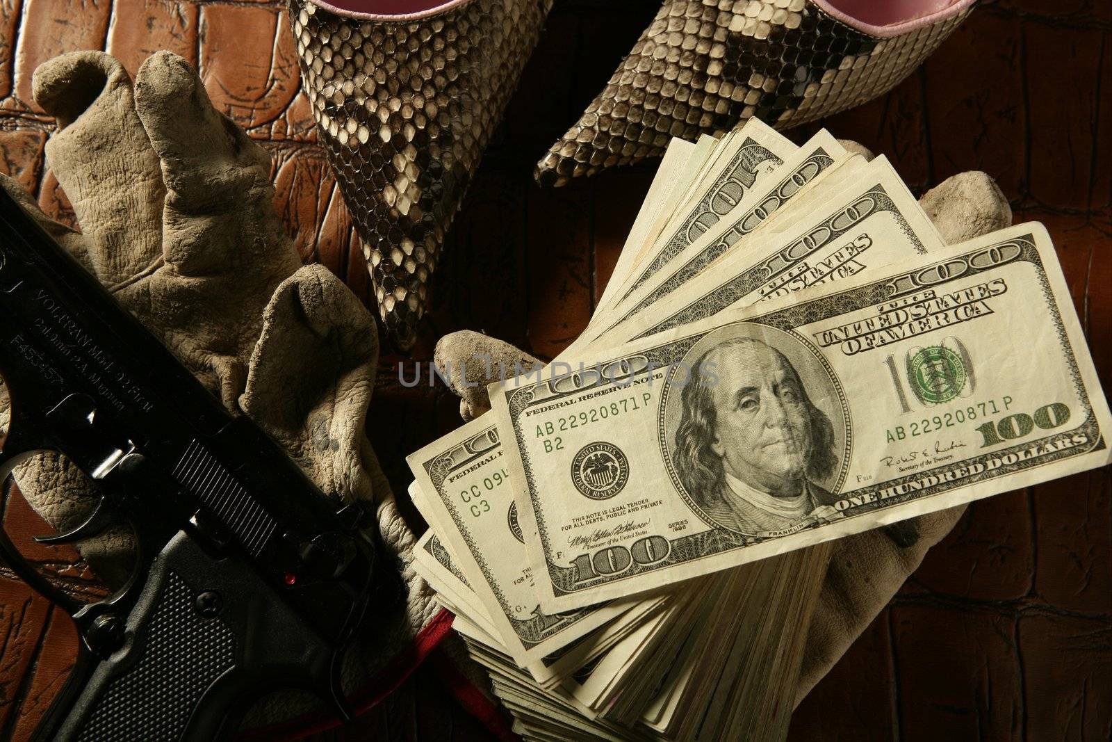 Dollar notes and gun, black pistol by lunamarina