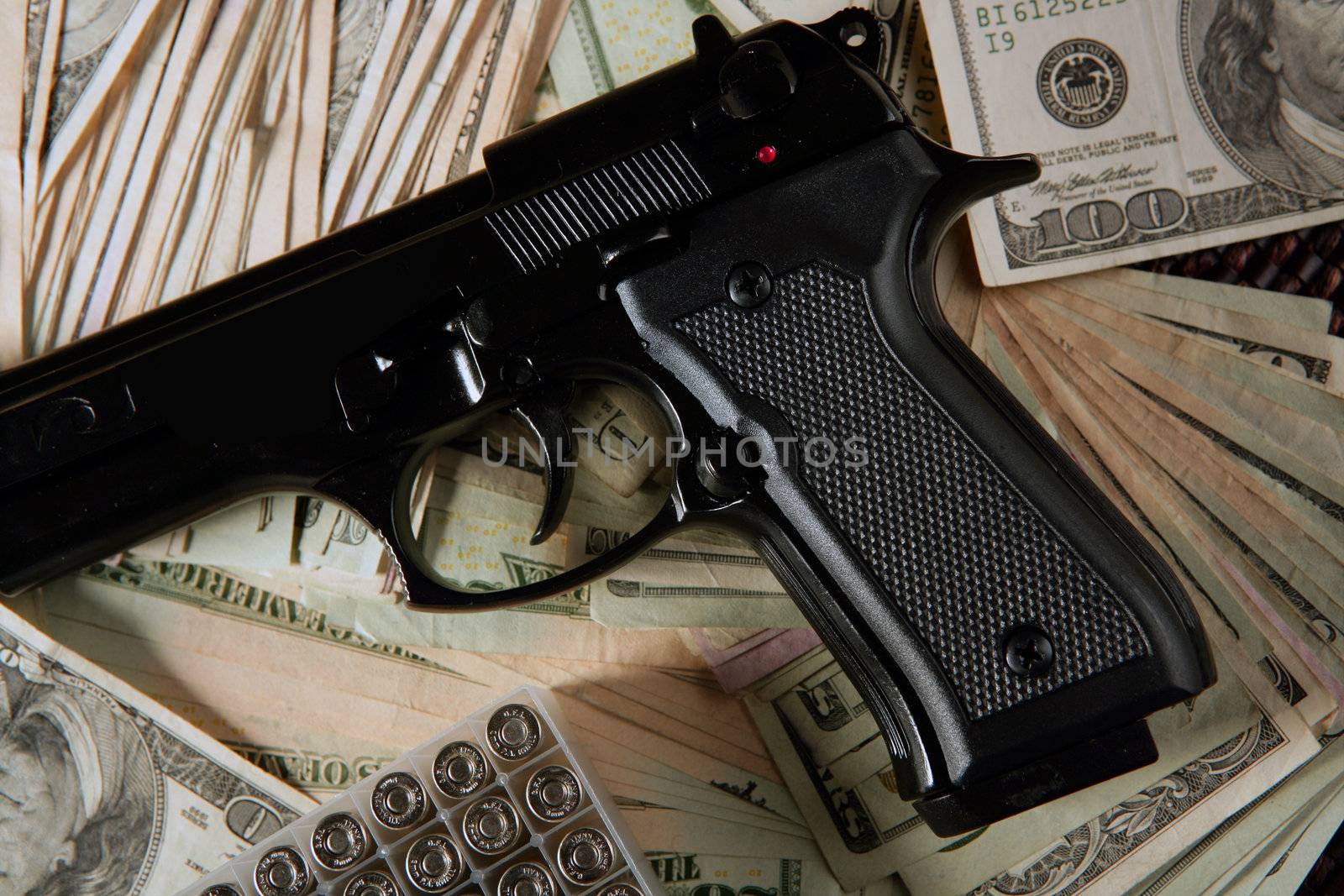 Dollar notes and gun, black pistol, mafia inspiration