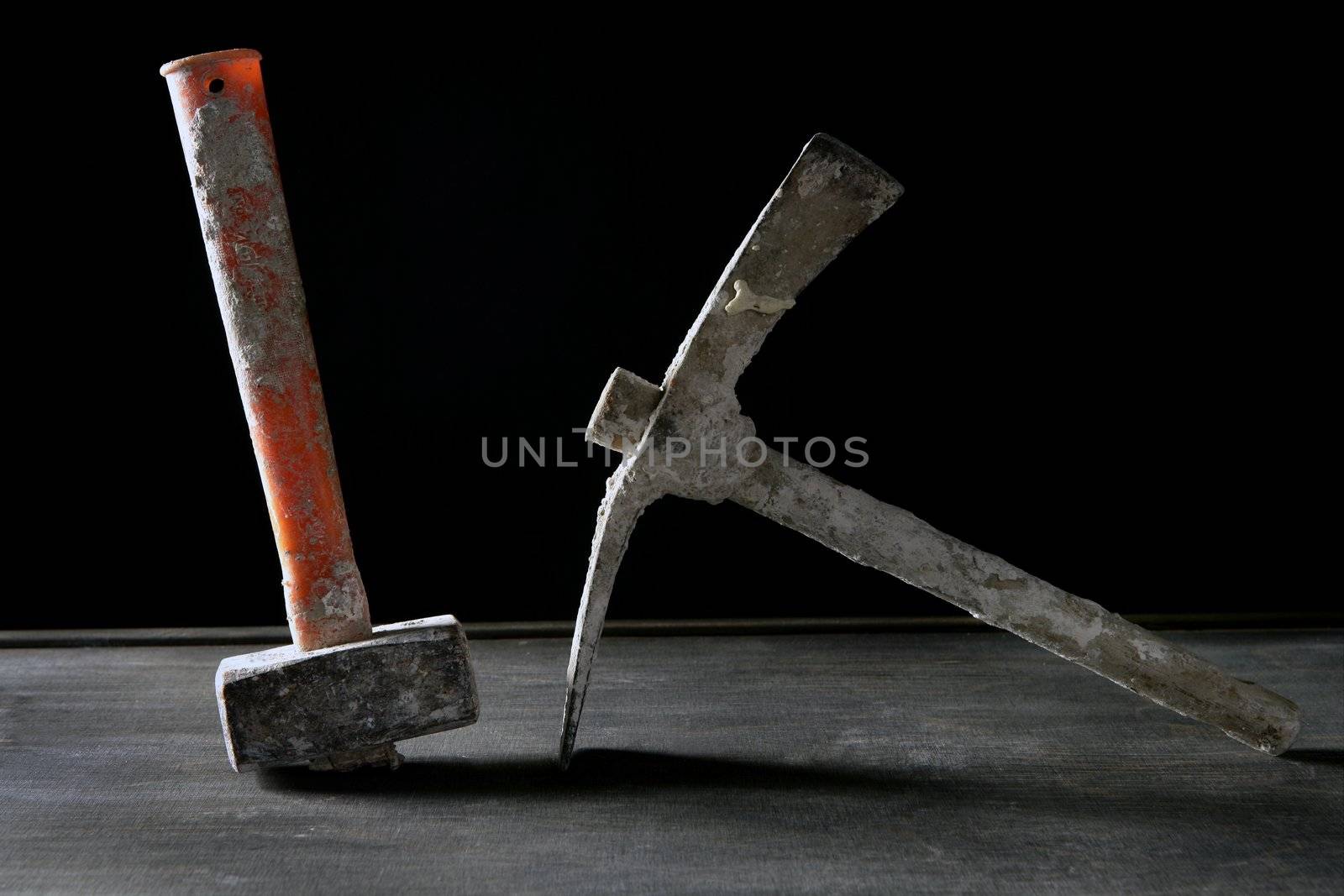 Hardware construction hand used dirty tools, studio over dark black wood