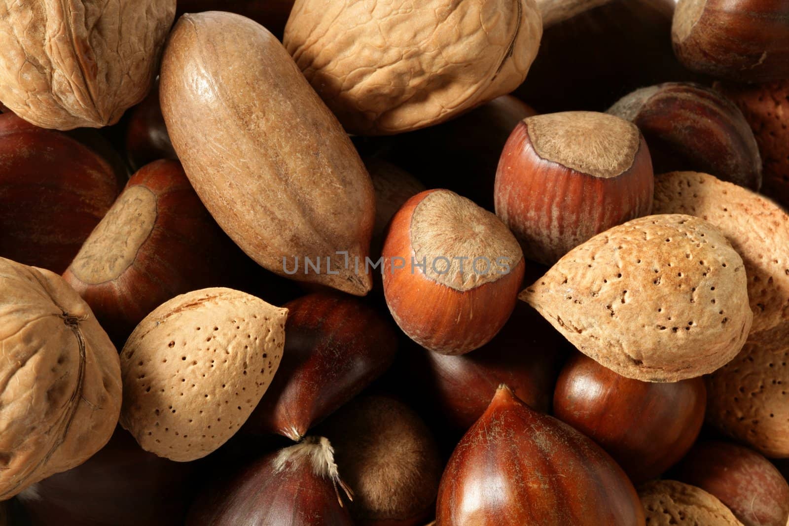 Nuts mix, walnuts, pecam hazelnut, almond, chestnut, crop texture background