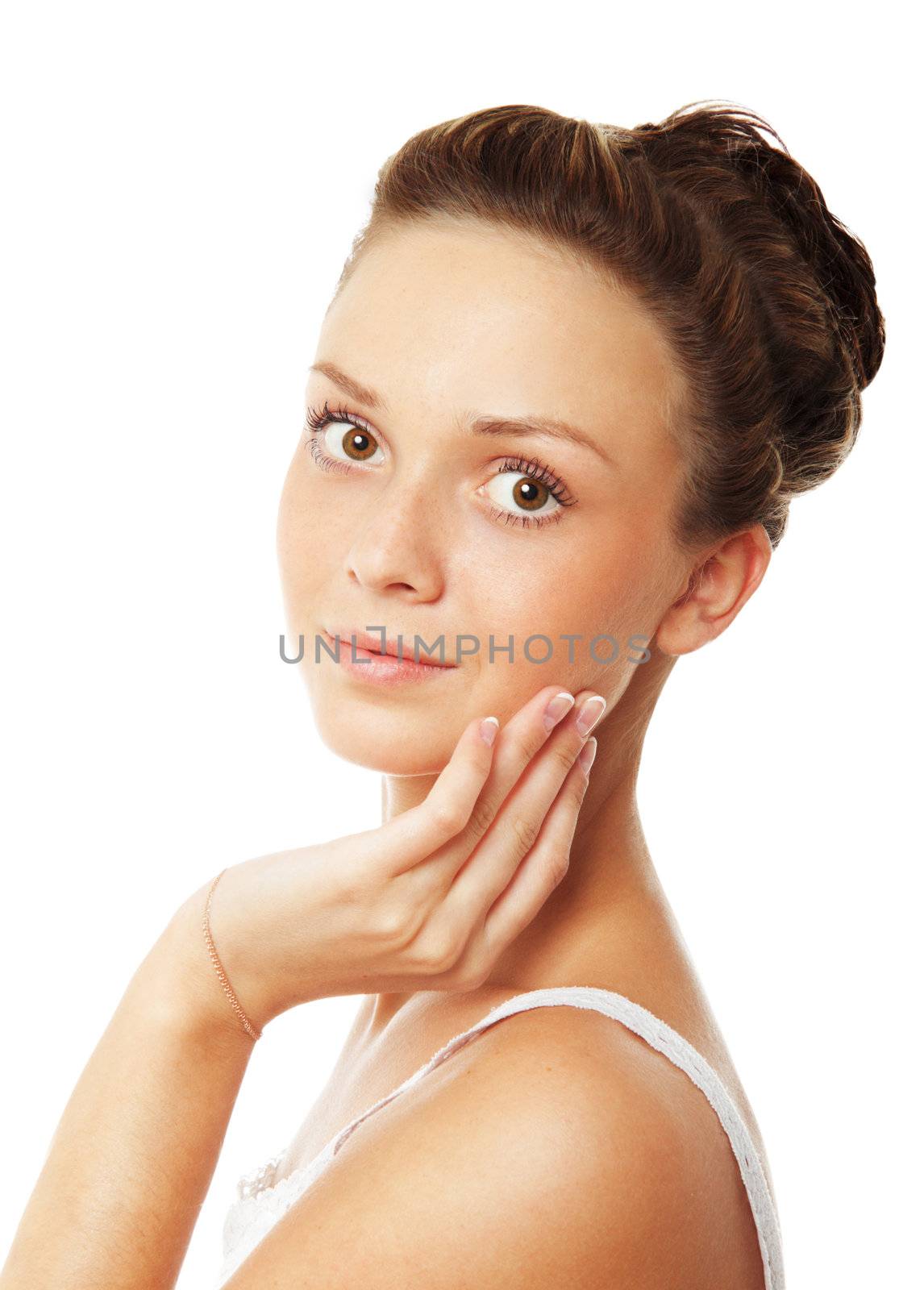 Young beautiful woman is touching her face. Isolated over white background