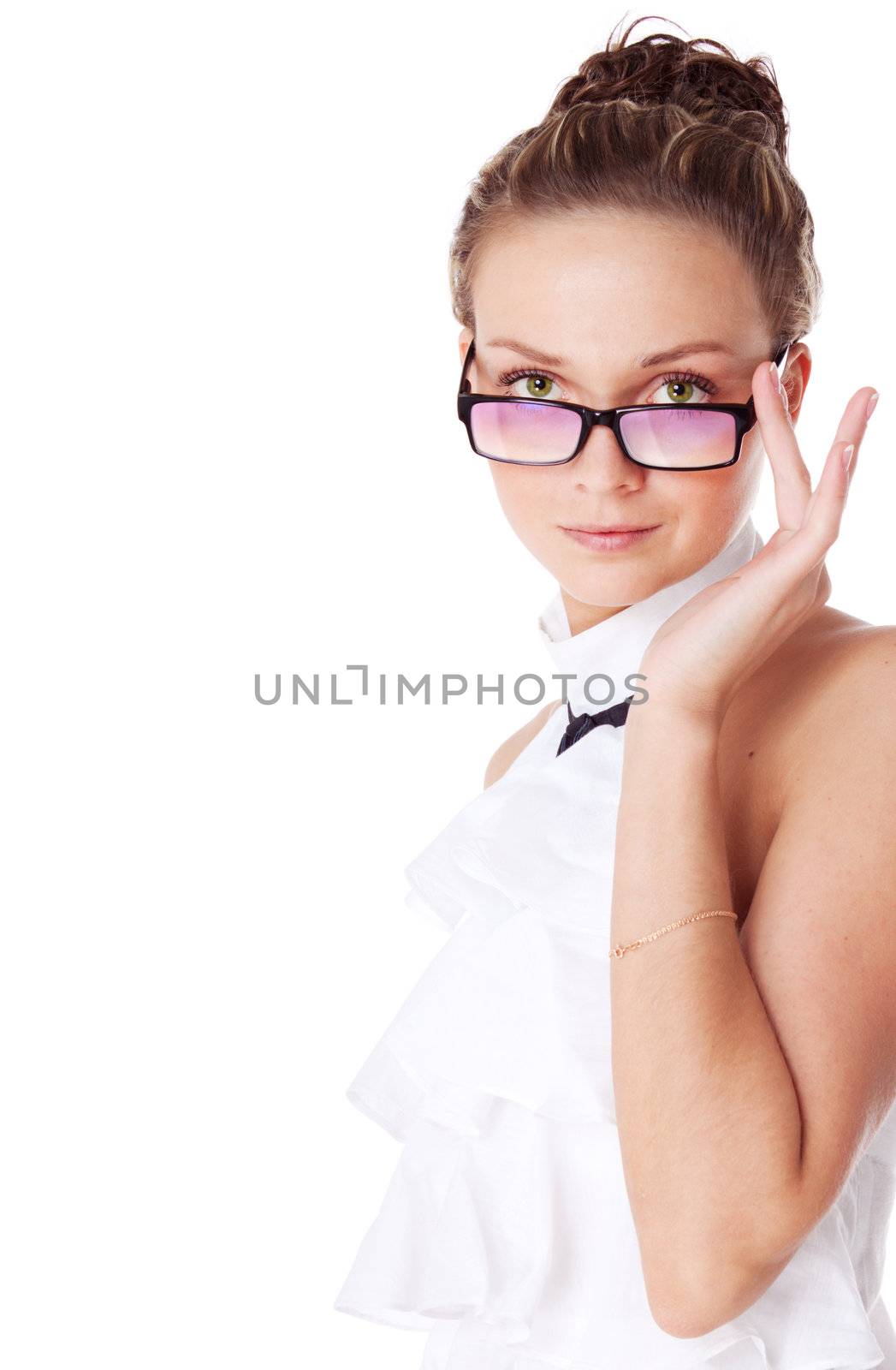 Beautiful young woman in touching her glasses. Isolated over white background