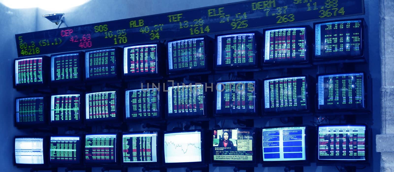 stock market multiple screen with euro reports in Spain
