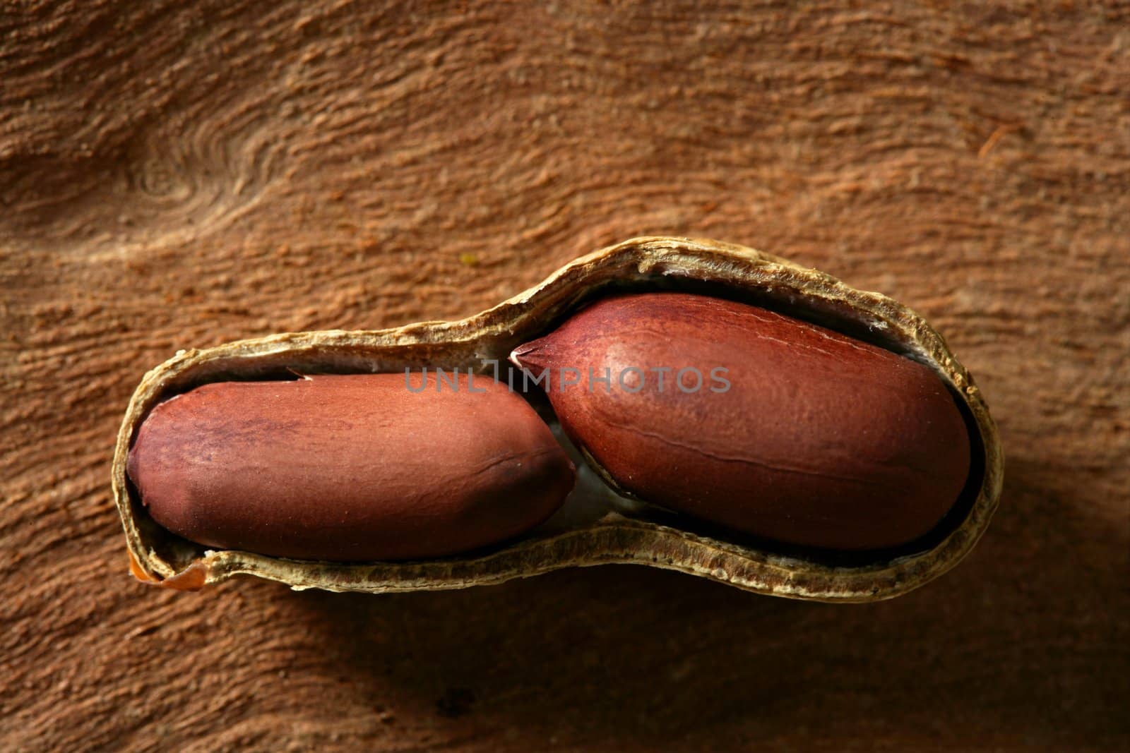 Peanuts macro over warm wood background