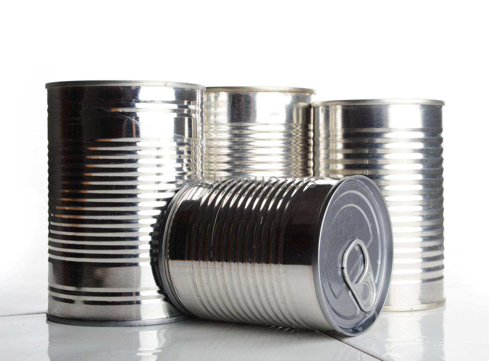 four silver food cans, one can on it's side show the ring pull on the lid