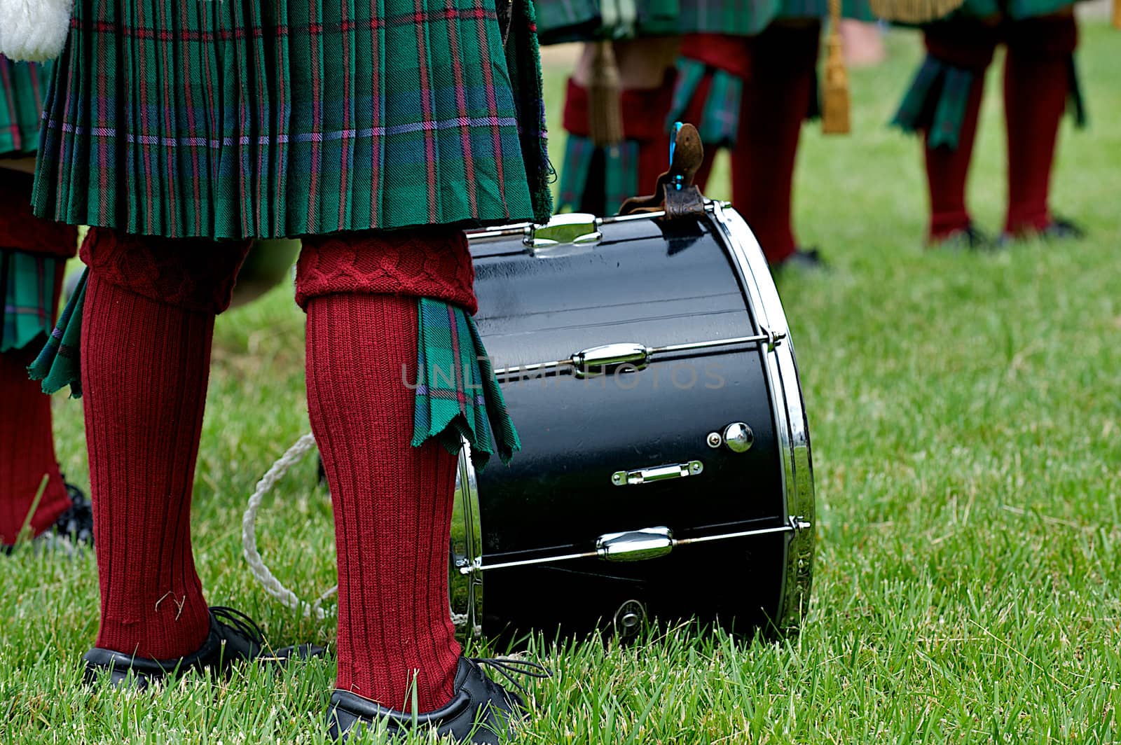 Scottish kilt and socks of a drummer in a bagpipe band showing the cultural heritage that exists in the US at a Memorial Day event.