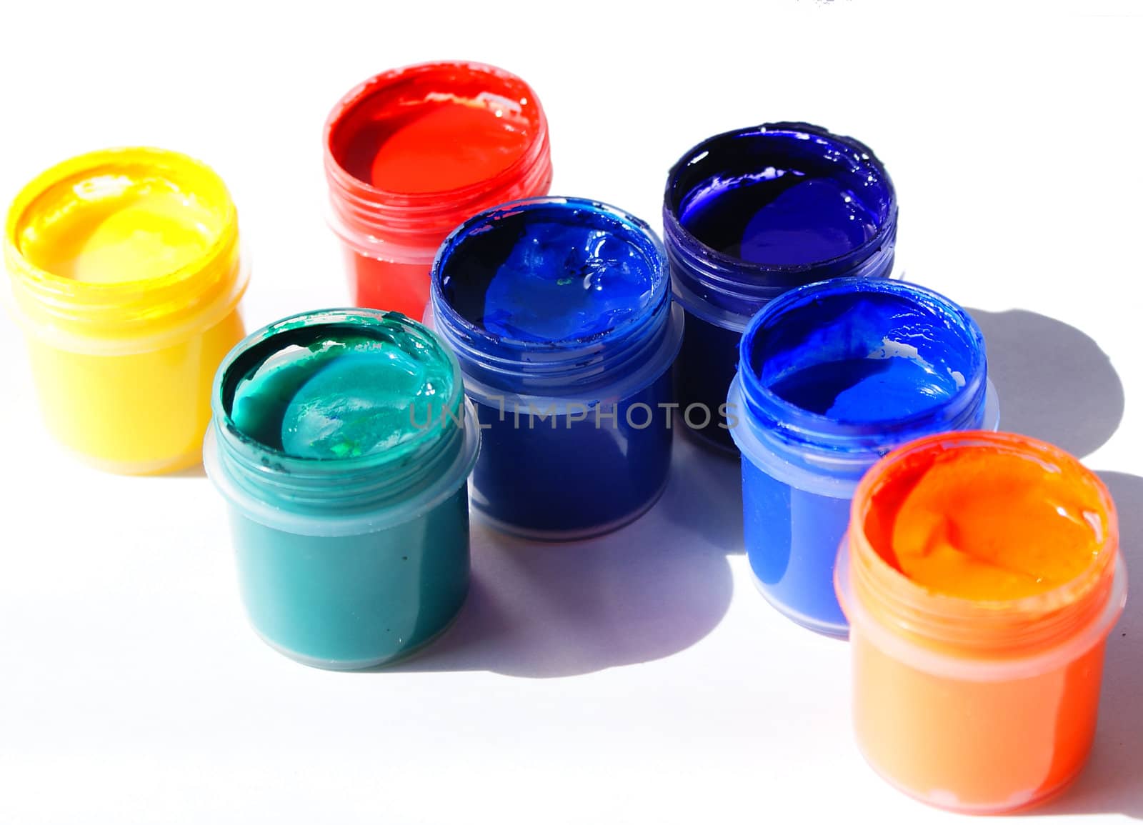 tubes with acrylic paints isolated against white background