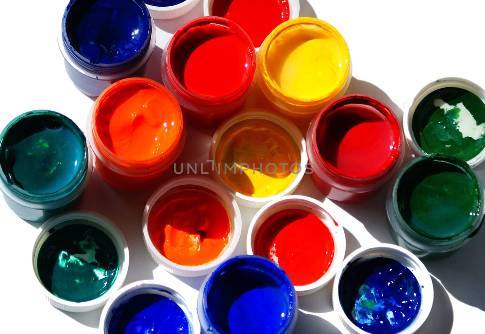 tubes with acrylic paint isolated against white background