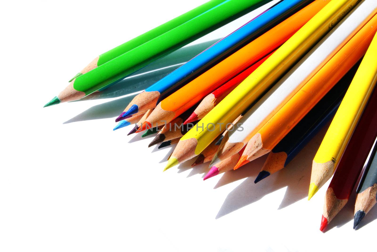 isolated set of crayons spread on a white background