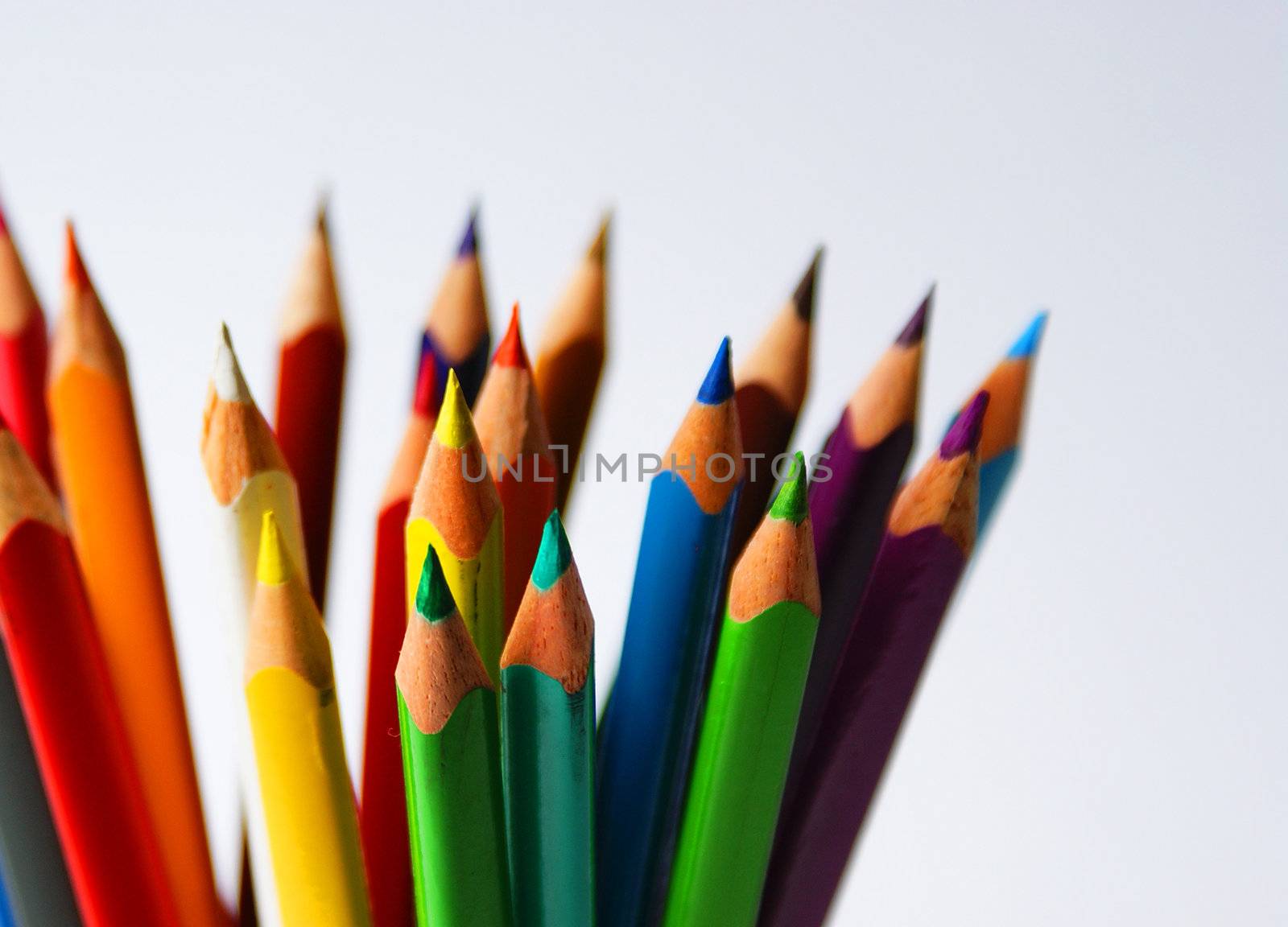 set of colored crayons isolated against white background