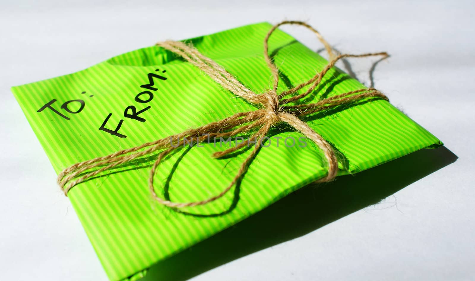 personal letter in a green tied envelope