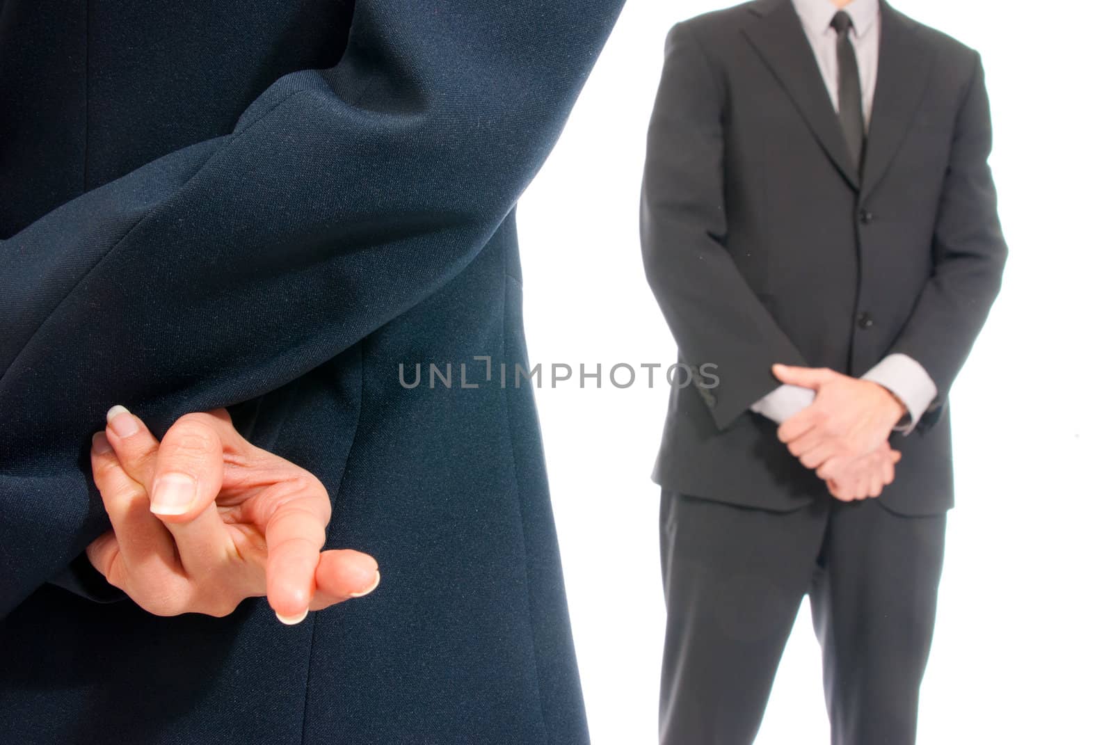 Business concept fingers crossed in front of boss isolated on white background