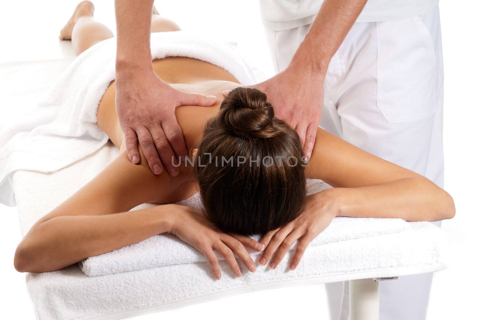 Unrecognizable woman receiving massage relax treatment close-up from male hands by dgmata
