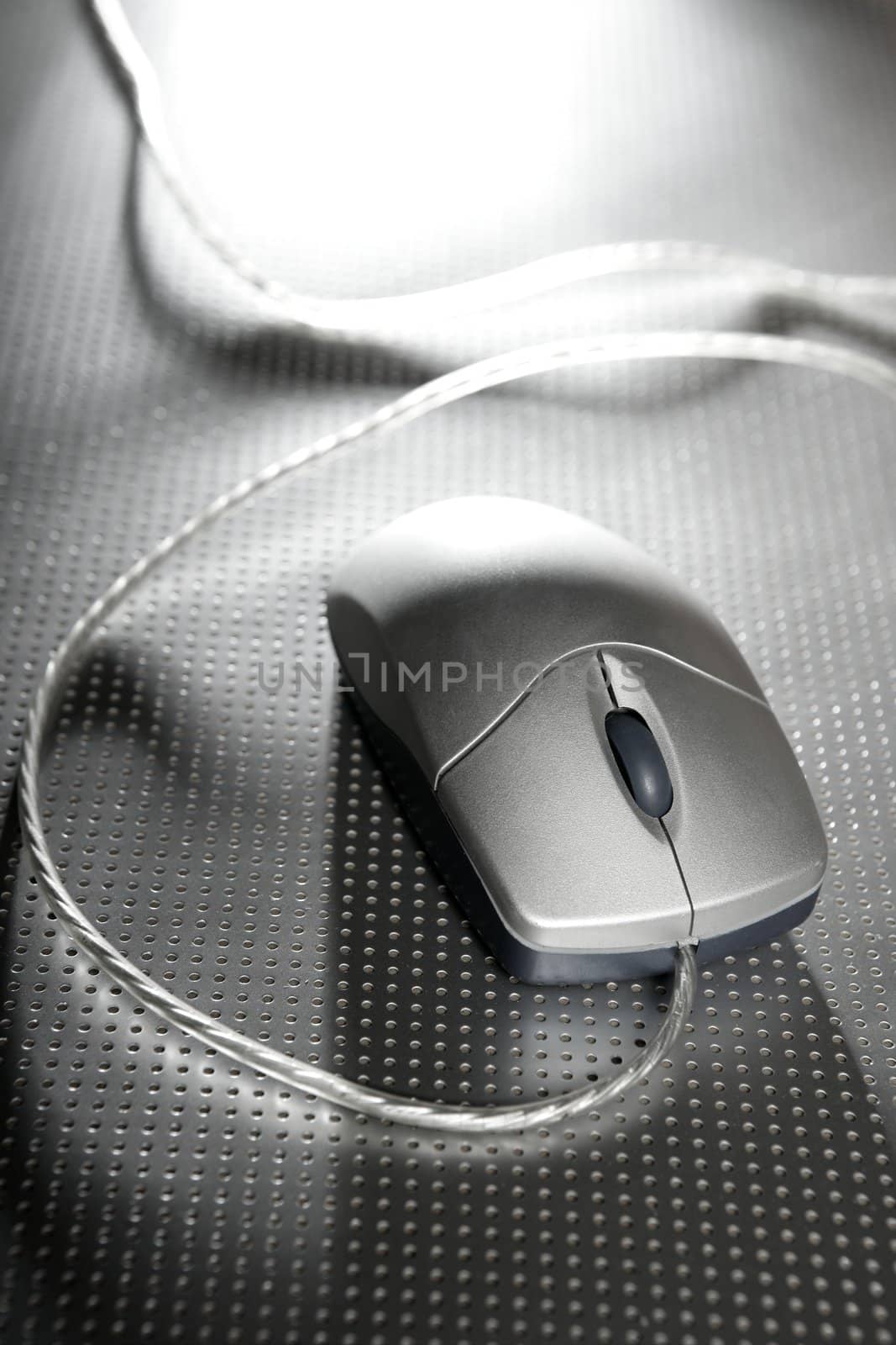 Silver computer wired mouse over metal steel background by lunamarina