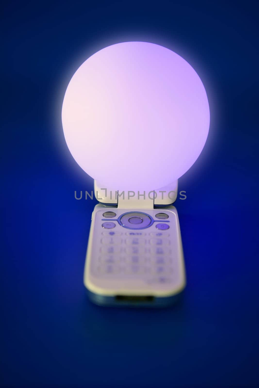 glowing light sphere on mobile cellphone by lunamarina