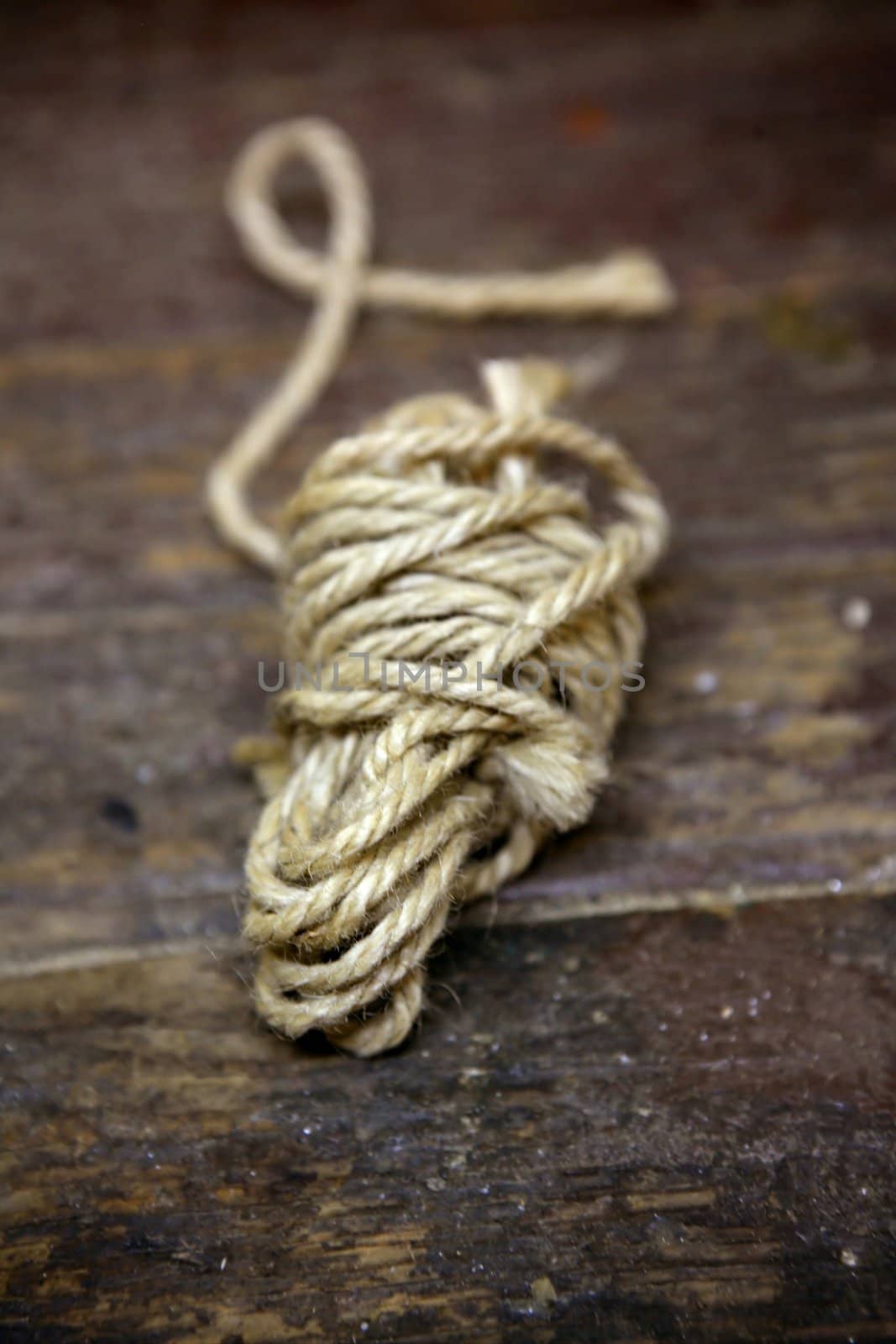 Thread old spool over an aged brown wooden surface