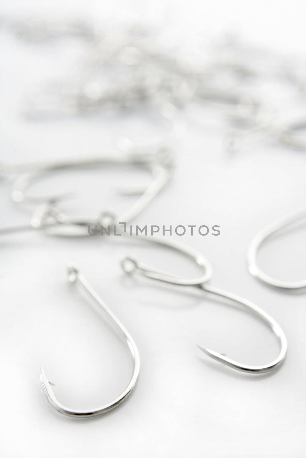 fishing hooks over white background, fisherman equipment