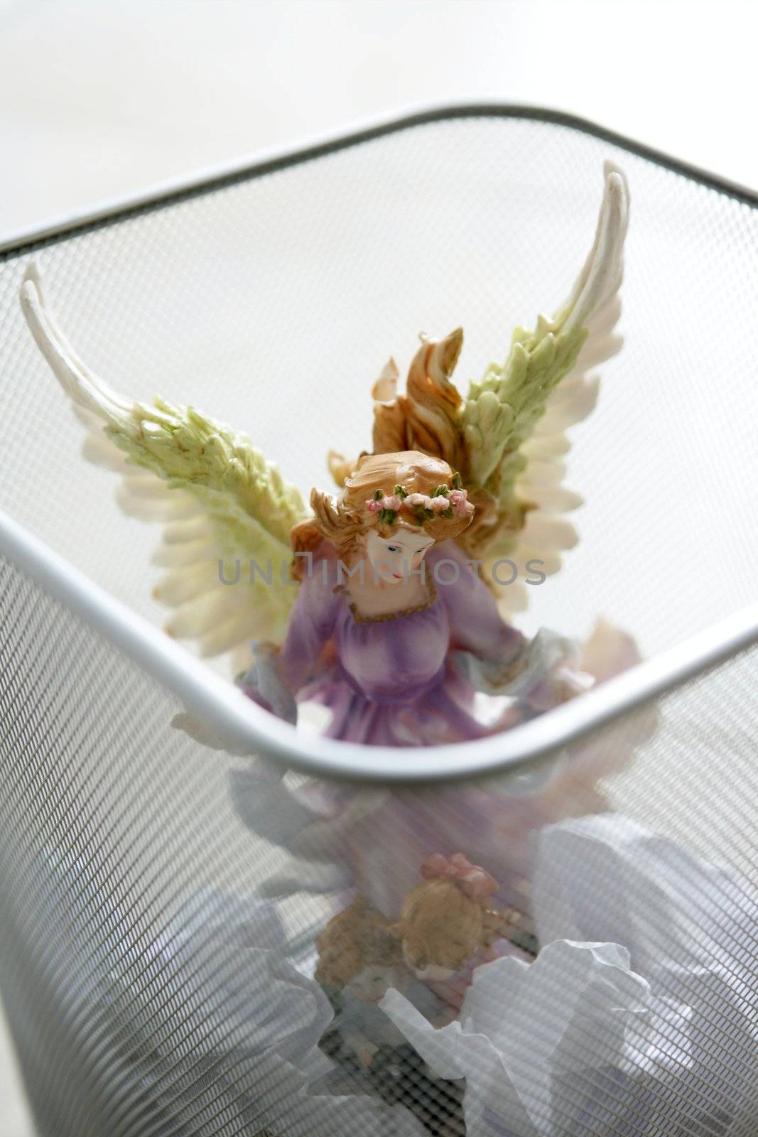 angel saint figure in the office trash by lunamarina