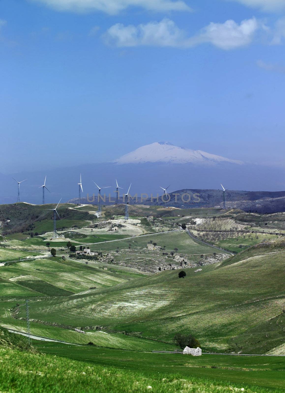 ITALY, Sicily, Francofonte/Catania province, countryside, Eolic energy turbines, the volcano Etna in the background