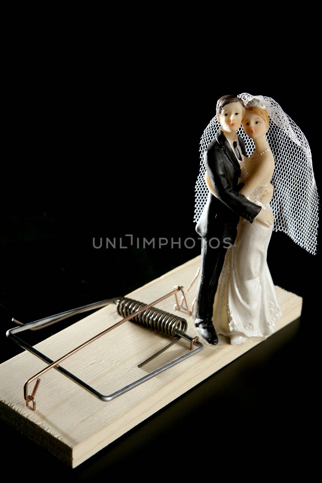 Marriage seen as a mouse trap classic male idea isolated over black