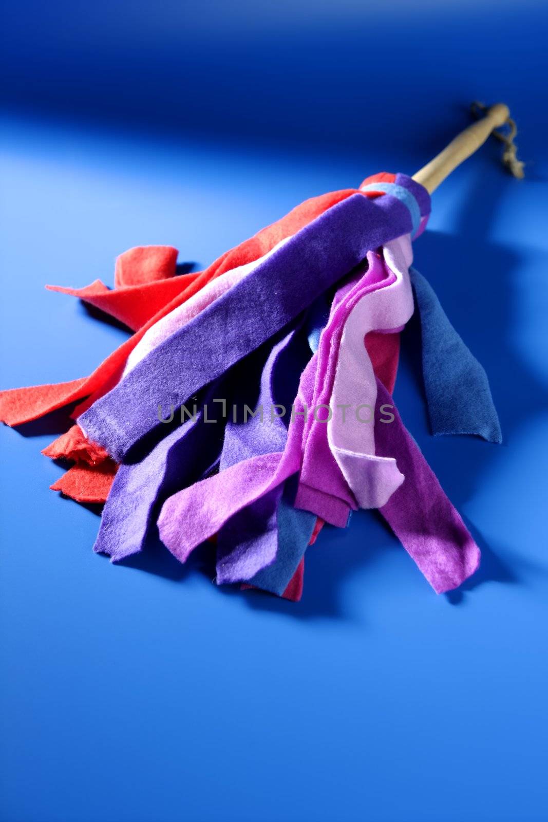 Housewife colorful duster cleaning tools over blue background