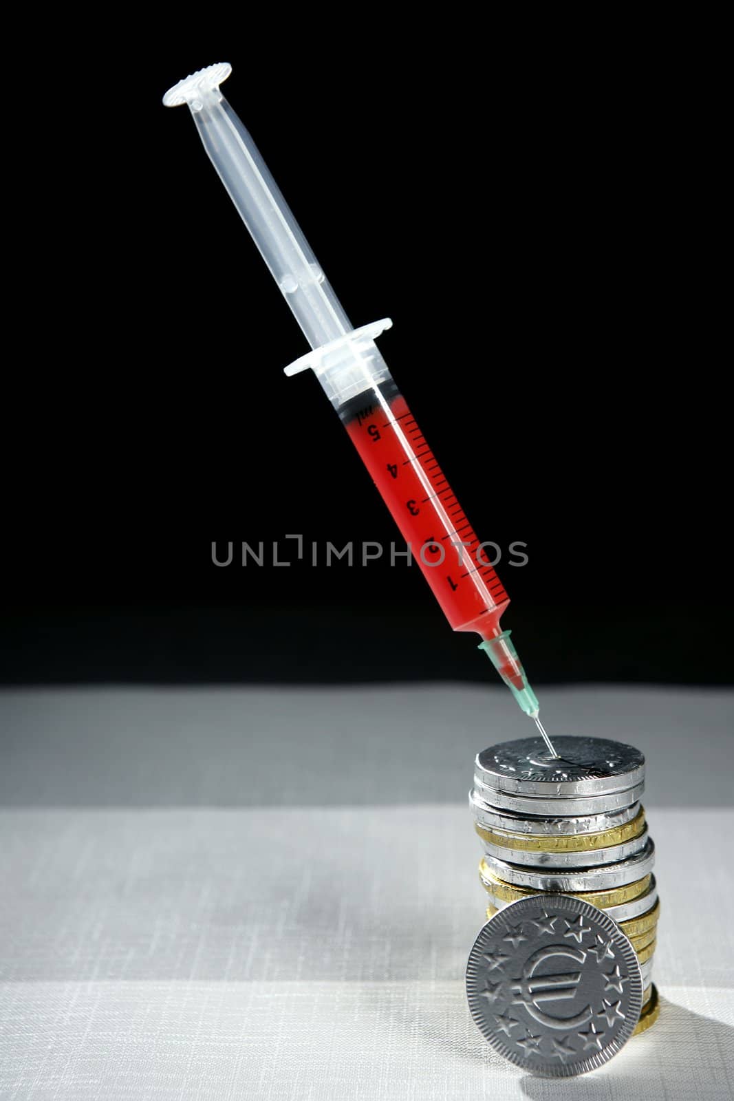 Euro currency syringe injection. Bank crisis financial credit metaphor.