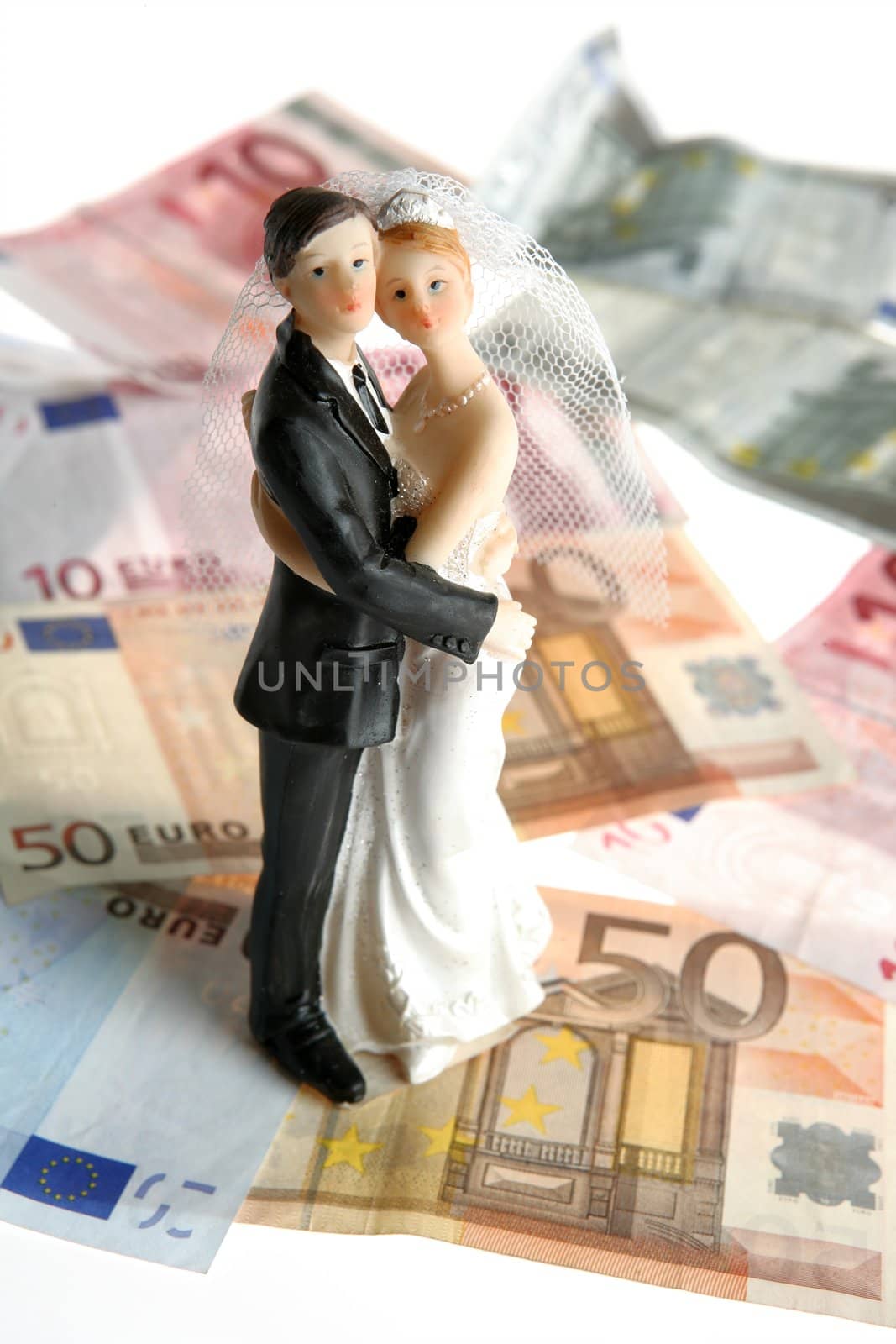 wedding couple figurine over euro notes by lunamarina