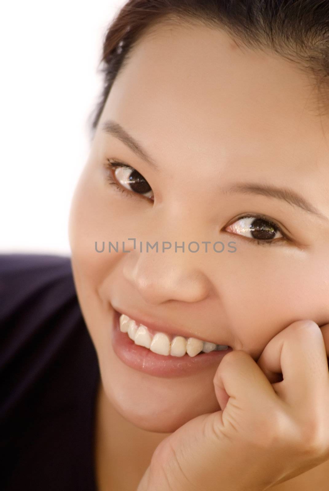 It is a portrait of beautiful eastern young lady smiling