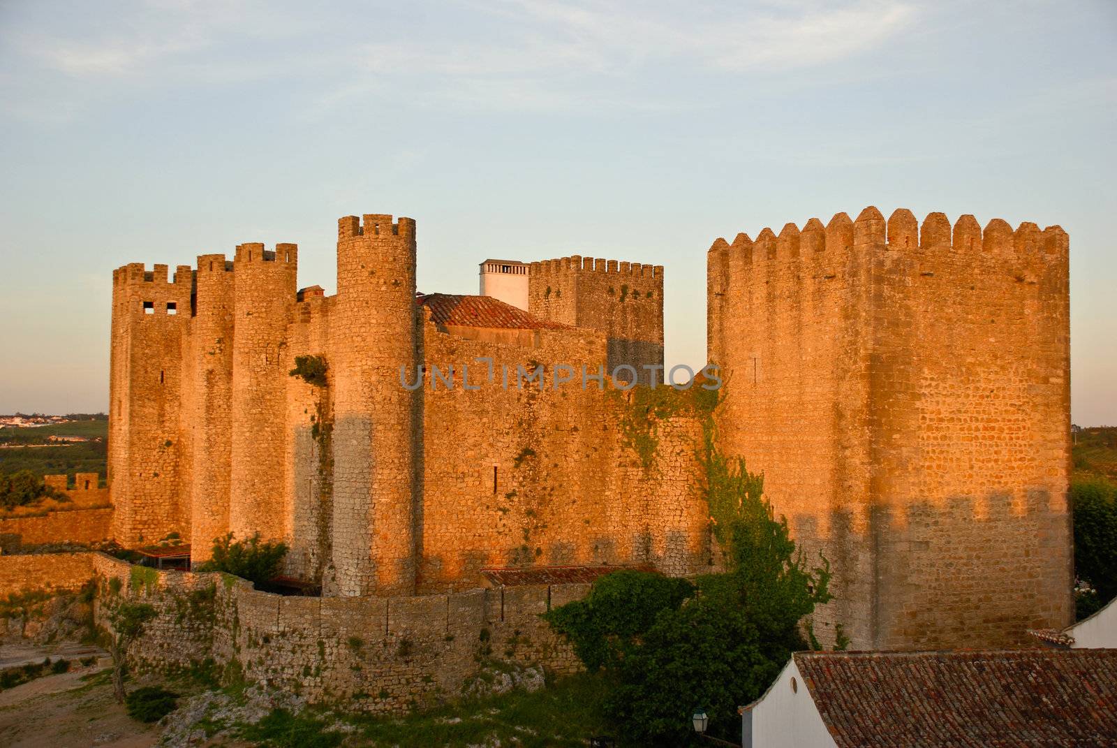 Ancient castle in Obidos, Portugal at sunset