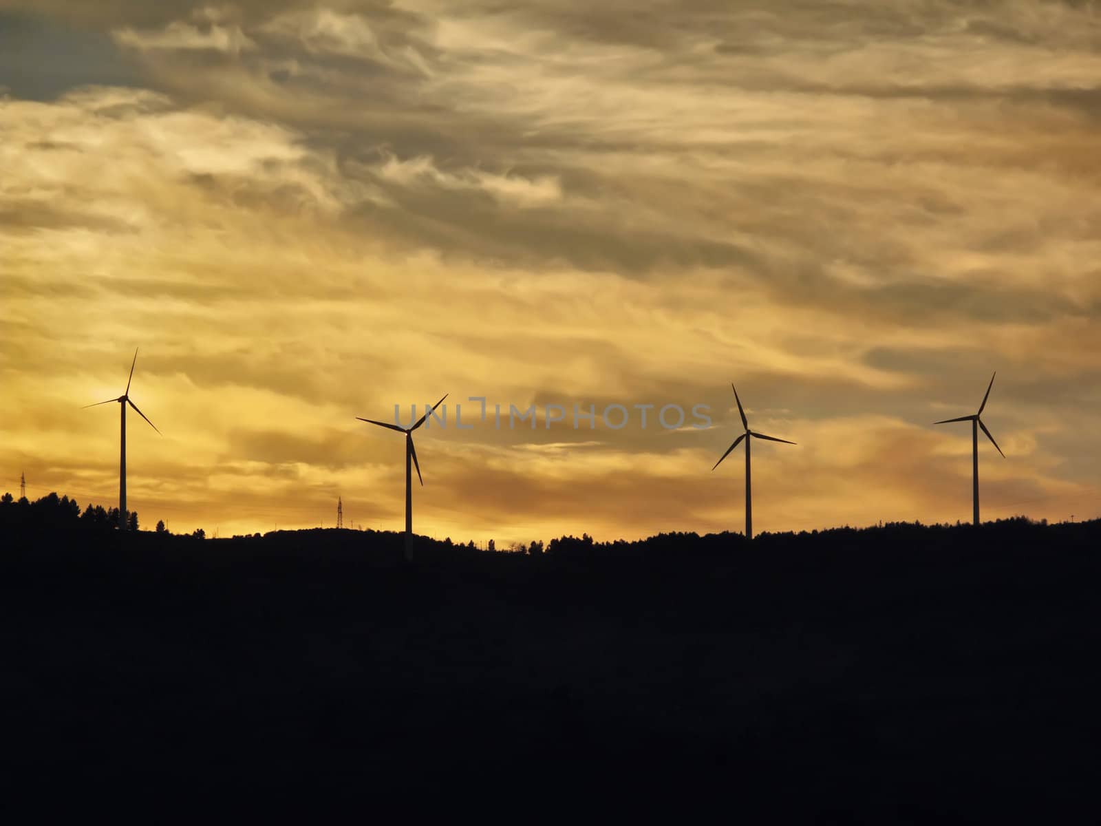 ITALY, Campania, Salerno, countryside, Eolic energy turbines at sunset                                 