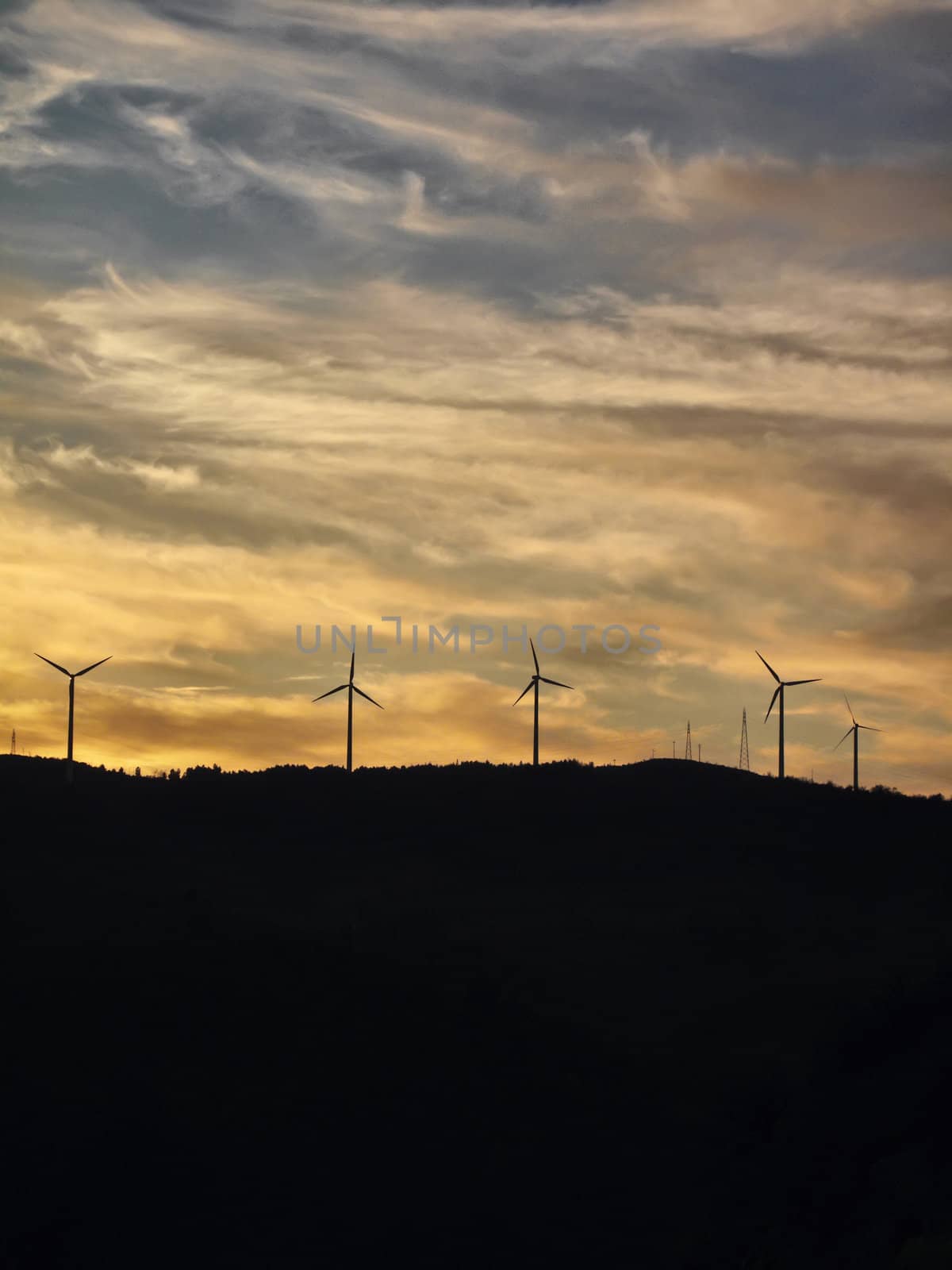  ITALY, Campania, Salerno, countryside, Eolic energy turbines at sunset                                  