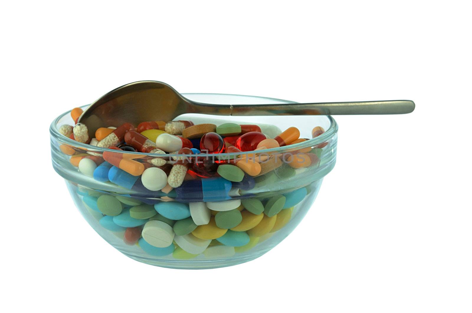 some different pills in a glass bowl 