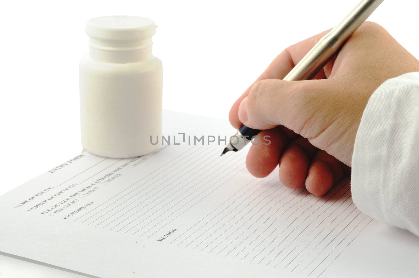 a doctors hand with an ink pen