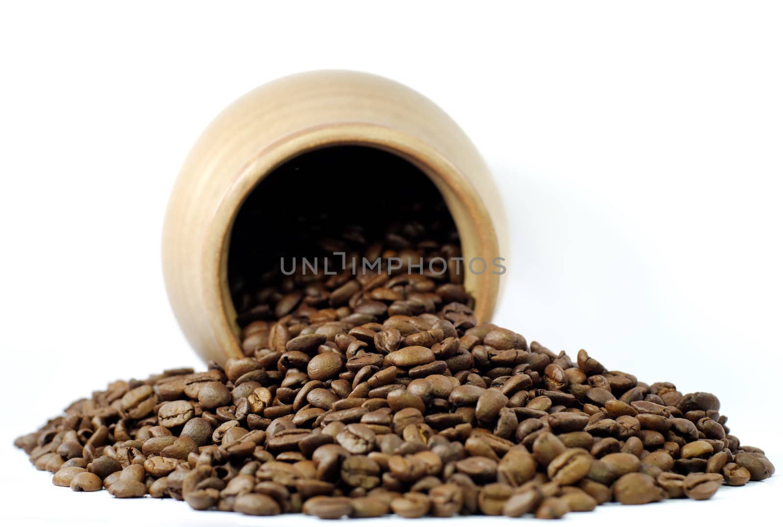 coffee beans in an earthenware pot