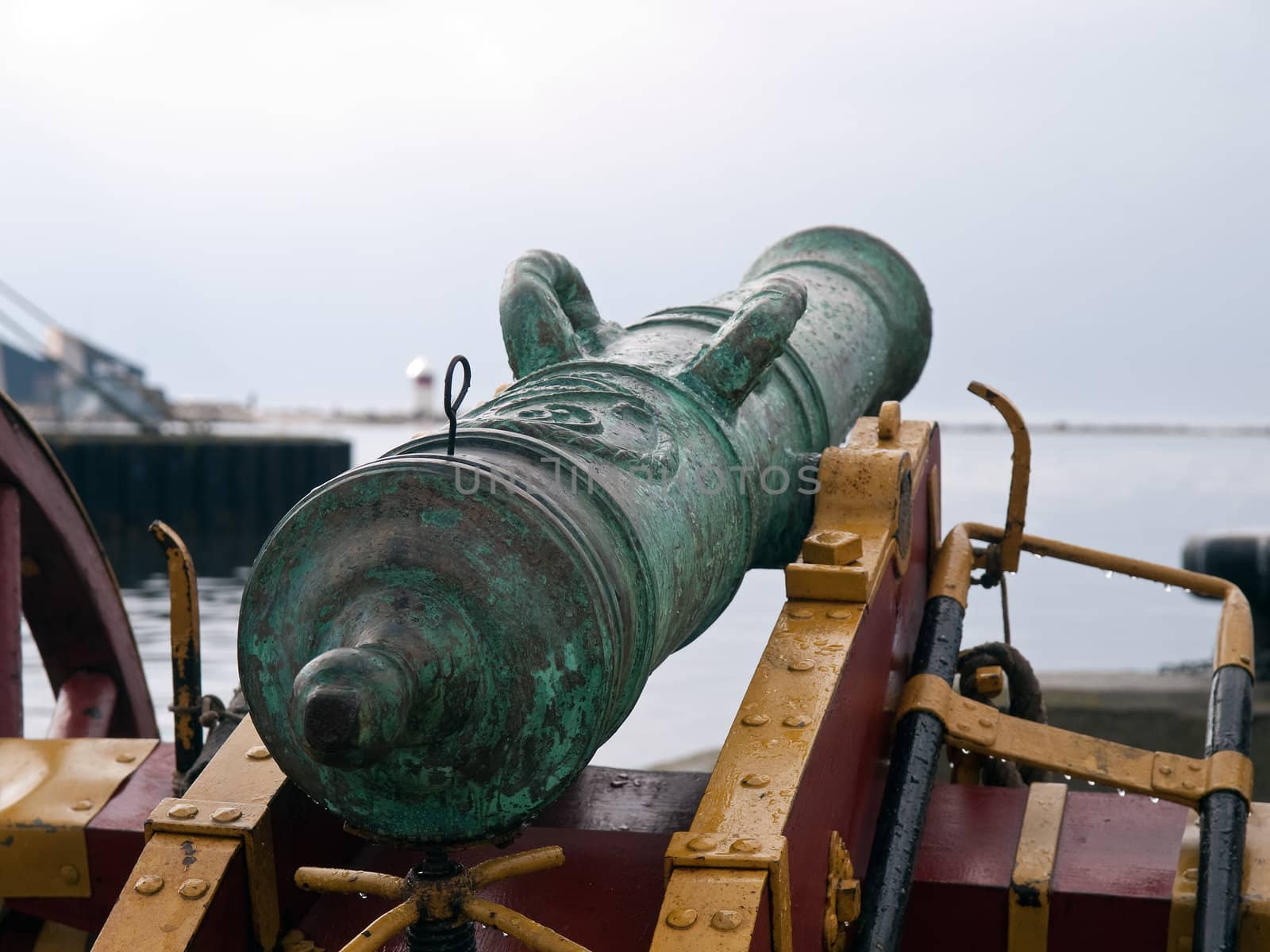 Old vintage cannon aiming at the ocean
