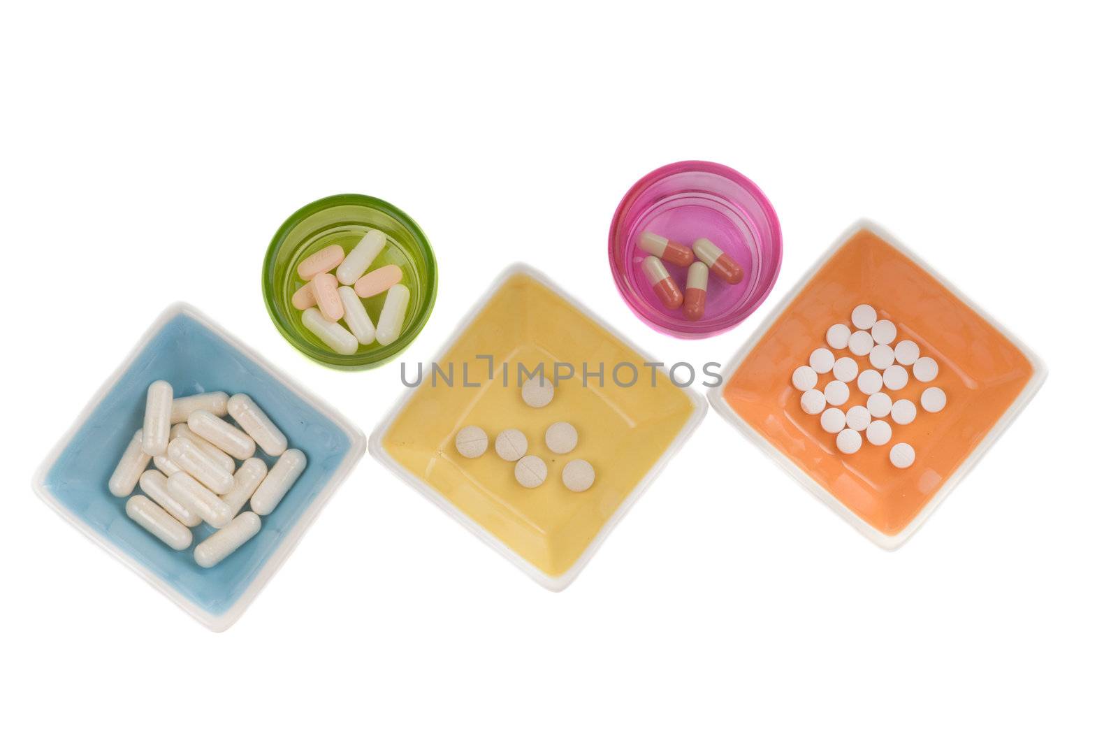 Shot of different pills isolated on white