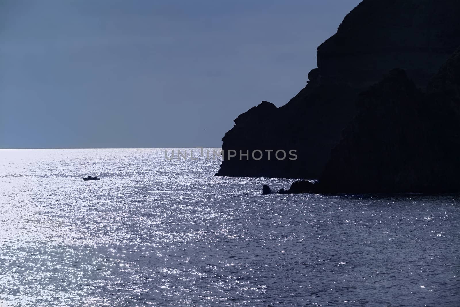 ITALY, Campania, Ischia island, S.Angelo, a fishing boat and S.Angelo rocky coast by agiampiccolo
