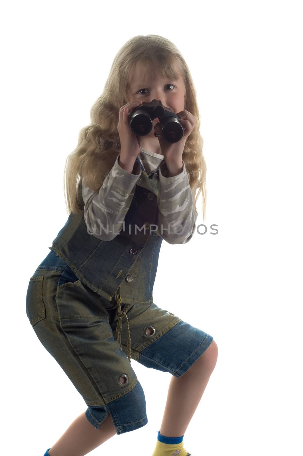 Shot of little girl with binoculars in studio