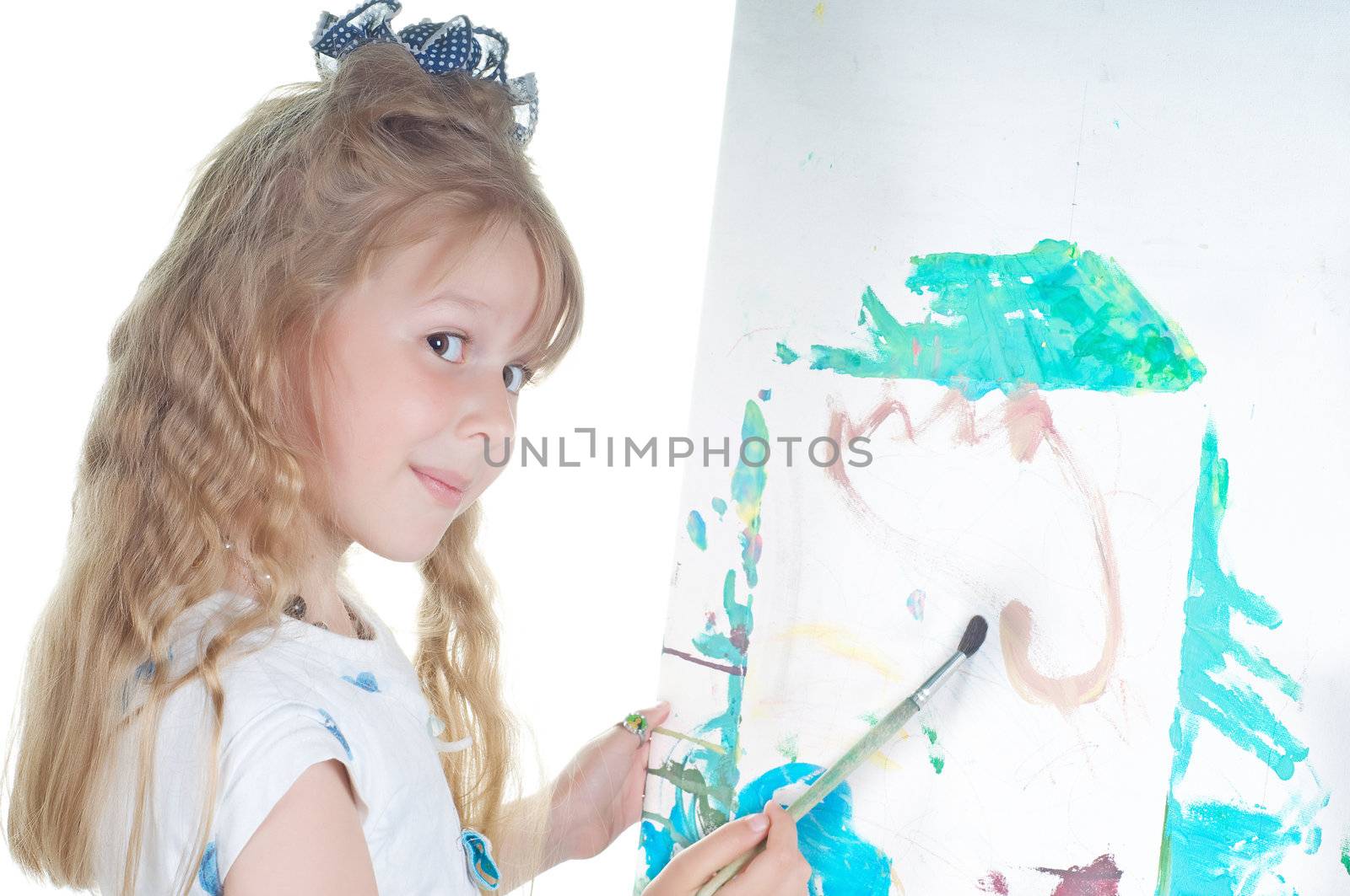 Shot of little girl painting in studio