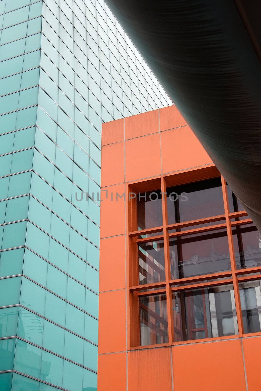 modern building in orange and green by elwynn