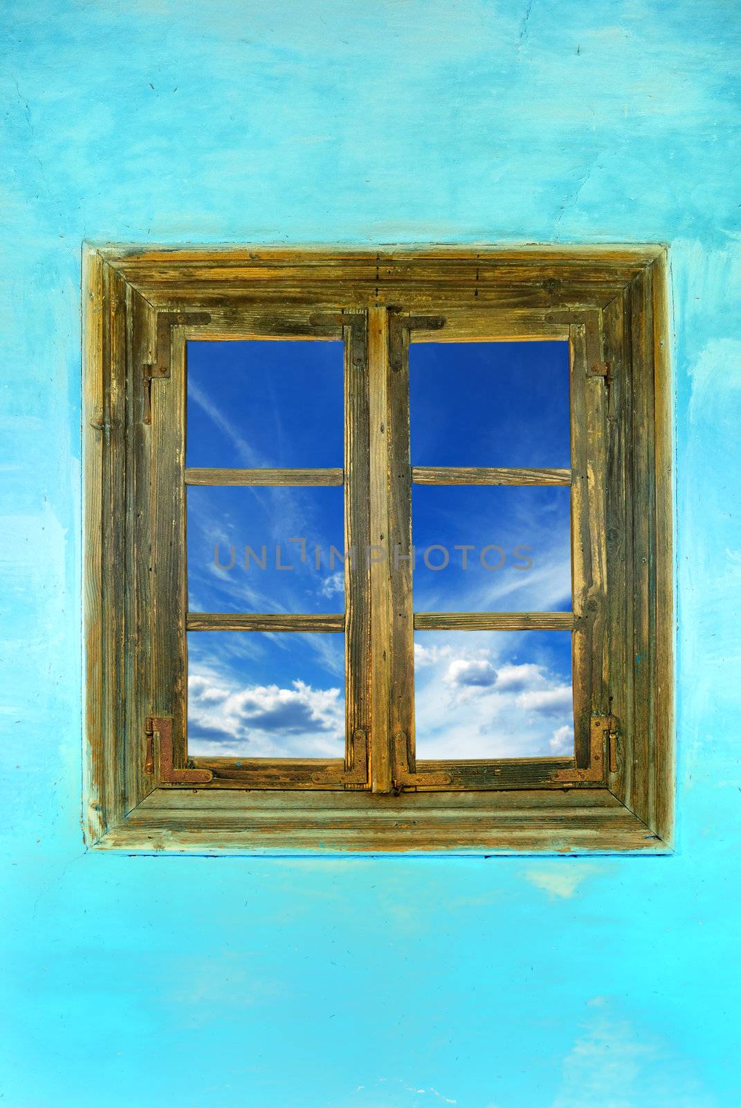 window of country house on a blue background with a  sky view 