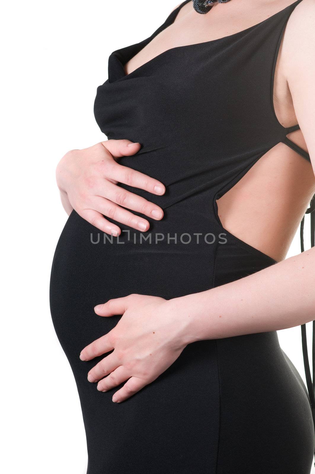 Shot of tummy pregnant woman isolated on white