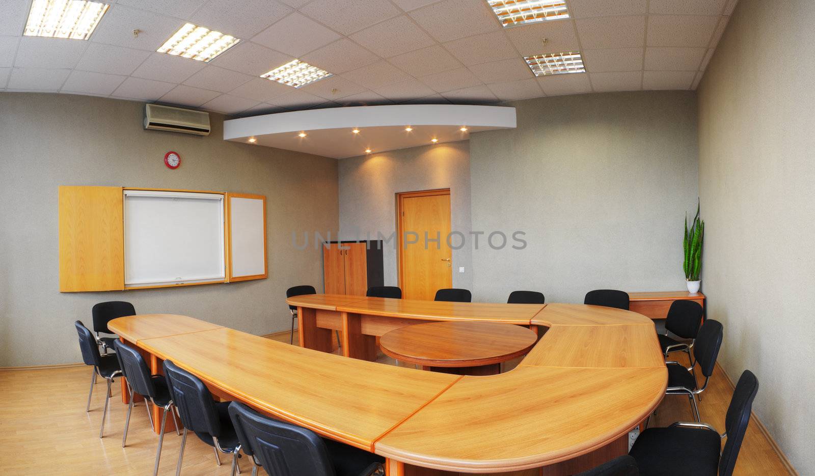Empty room for business meetings. Blank white board and long conference table