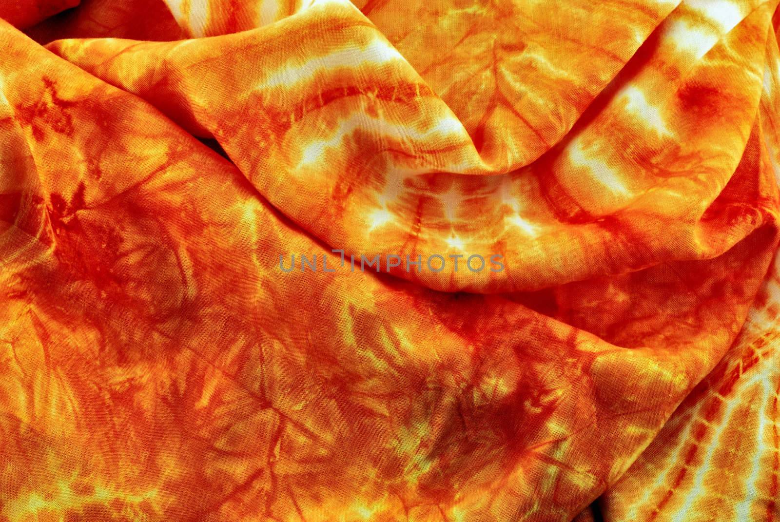 orange decorative fabric with an abstract pattern