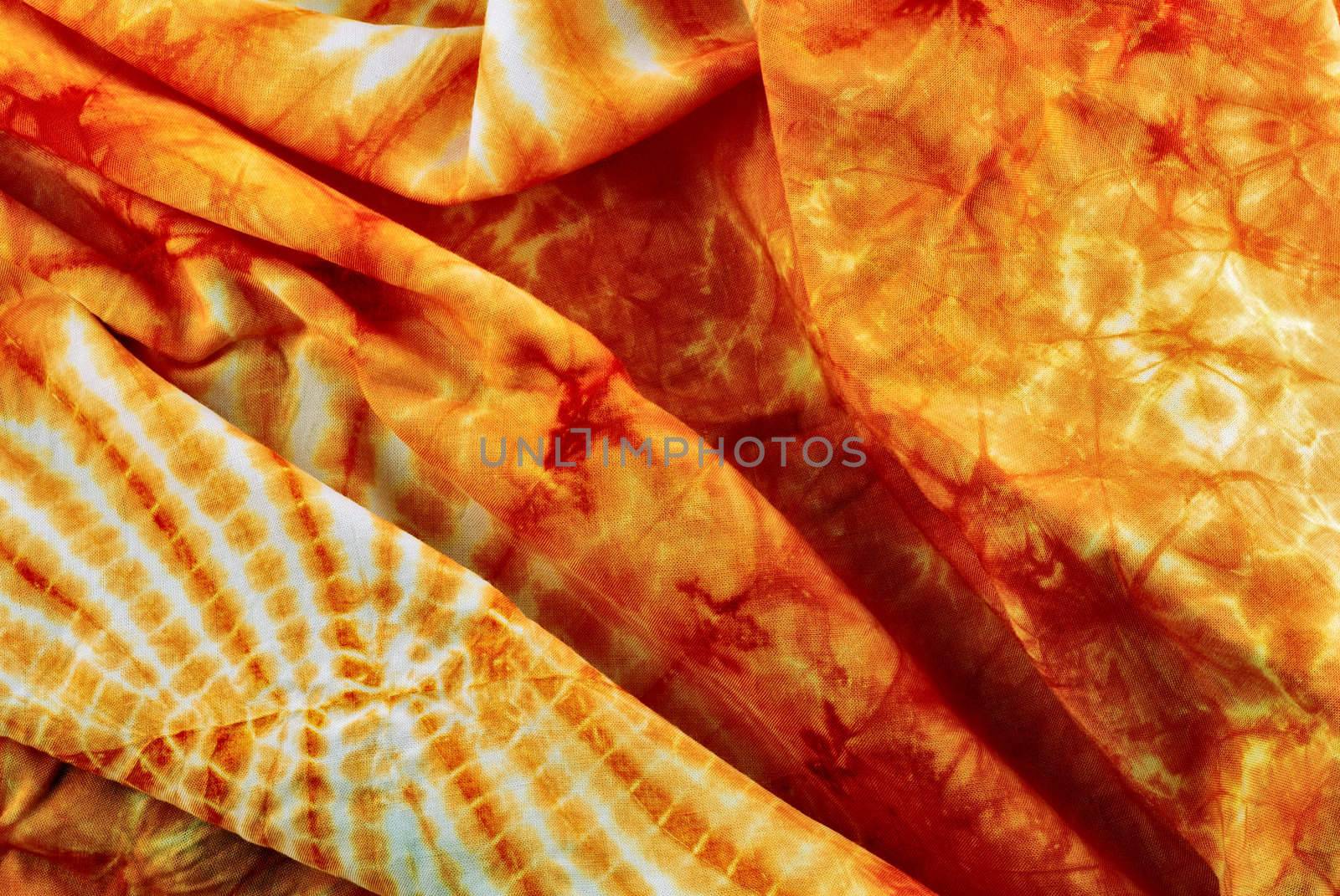 orange decorative fabric with an abstract pattern