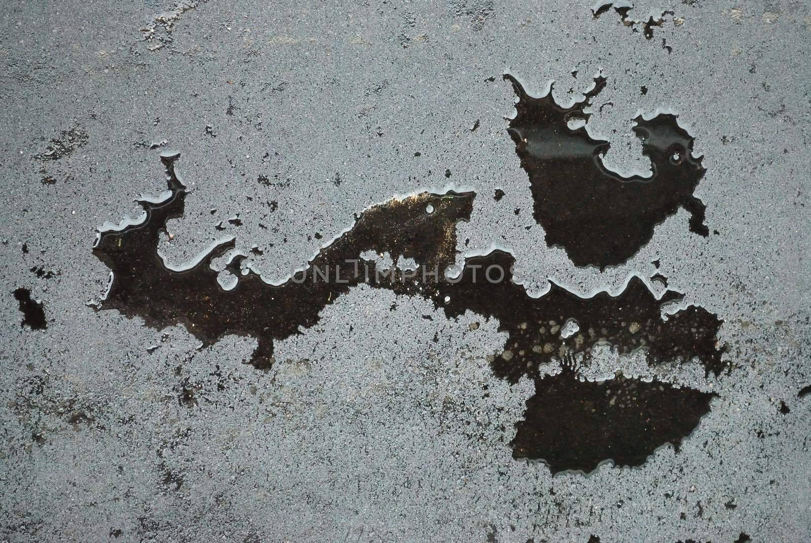 drops of rain water on a fresh asphalt